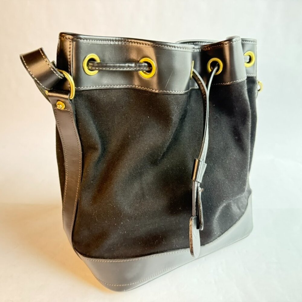 Dooney & Bourke Black Canvas with Leather Base and Rim and Gold Accents